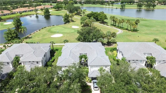 an aerial view of a house with a lake view