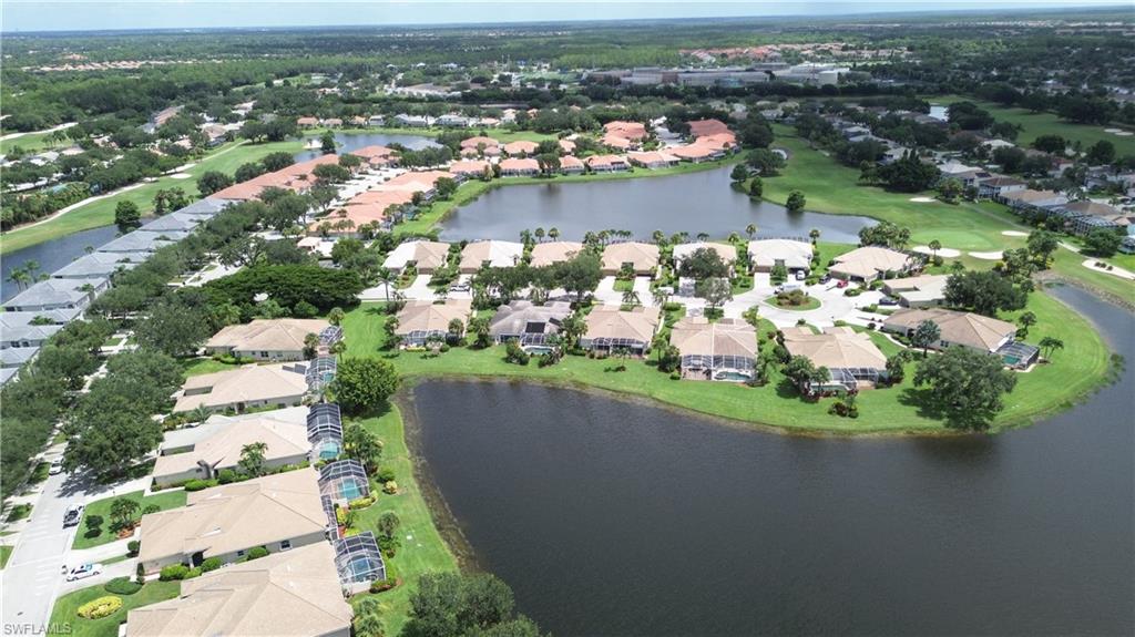 1937 Crestview Way, Unit 171 Naples, FL 34119 - Photo 33 of 39 an aerial view of a house with a lake view