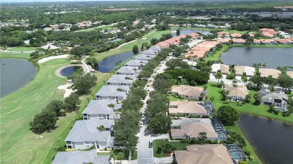 an aerial view of lake residential houses with outdoor space