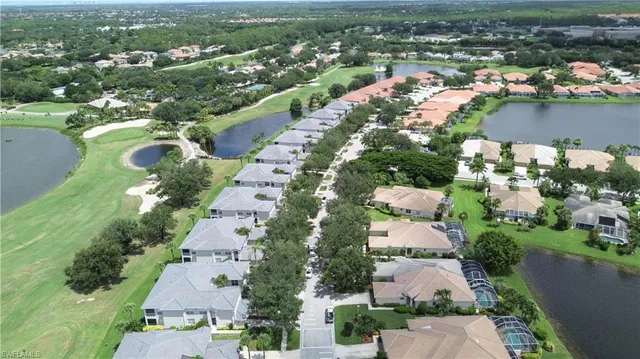 an aerial view of lake residential houses with outdoor space