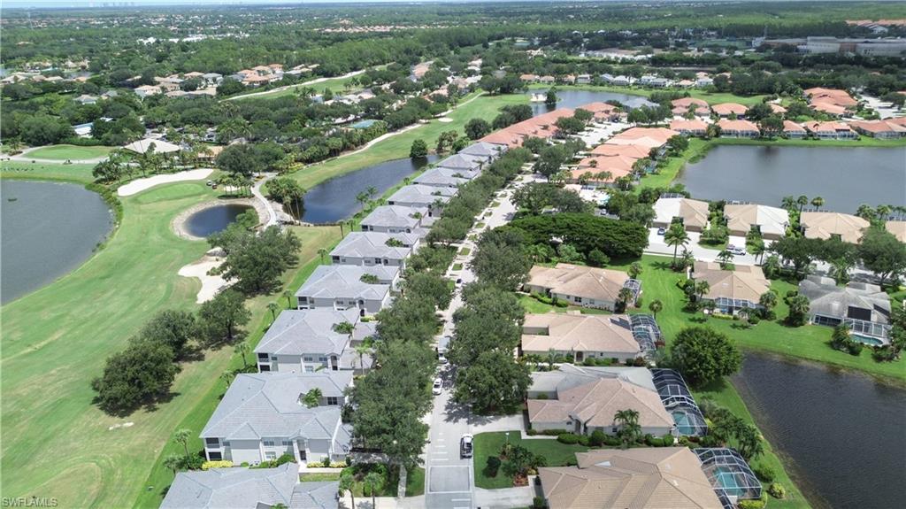 1937 Crestview Way, Unit 171 Naples, FL 34119 - Photo 34 of 39 an aerial view of lake residential houses with outdoor space
