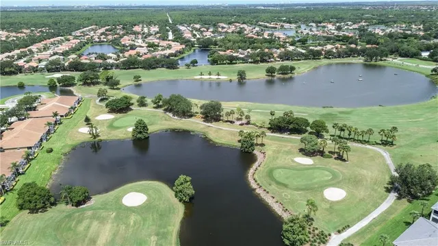 an aerial view of a house with a lake view