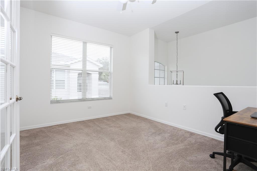 1937 Crestview Way, Unit 171 Naples, FL 34119 - Photo 7 of 39 a view of workspace with wooden floor and windows