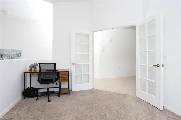 a view of a workspace with furniture