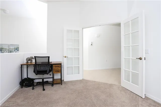 a view of a workspace with furniture