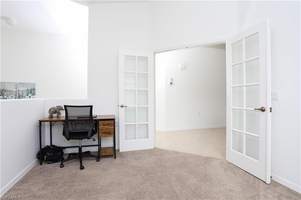 1937 Crestview Way, Unit 171 Naples, FL 34119 - Photo 8 of 39 a view of a workspace with furniture