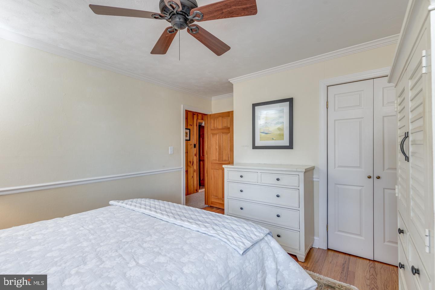 7 Forest Avenue Medford, NJ 08055 - Photo 20 of 43 a bedroom with a bed and a chandelier fan