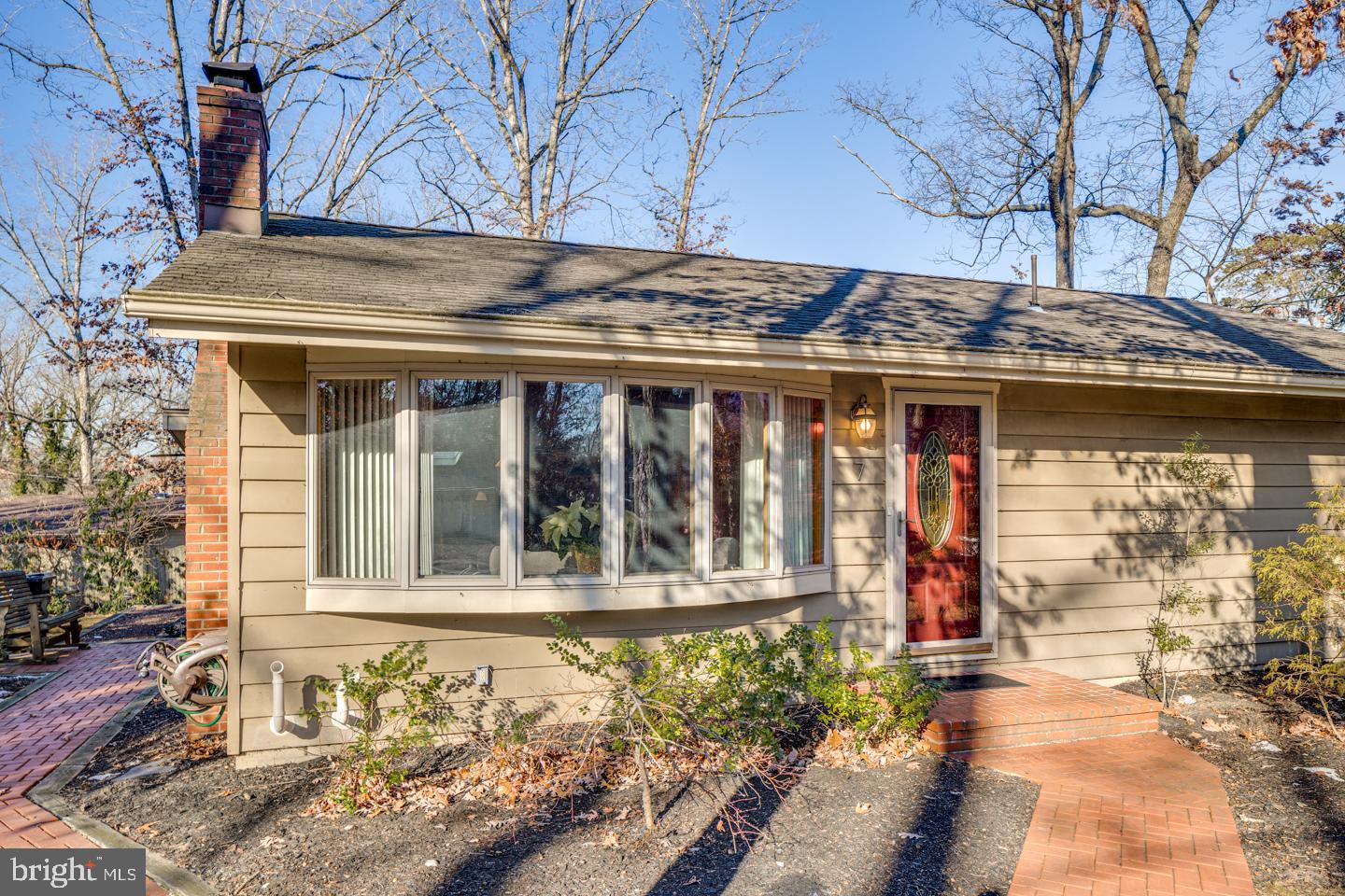 7 Forest Avenue Medford, NJ 08055 - Photo 2 of 43 a front view of a house with a garden