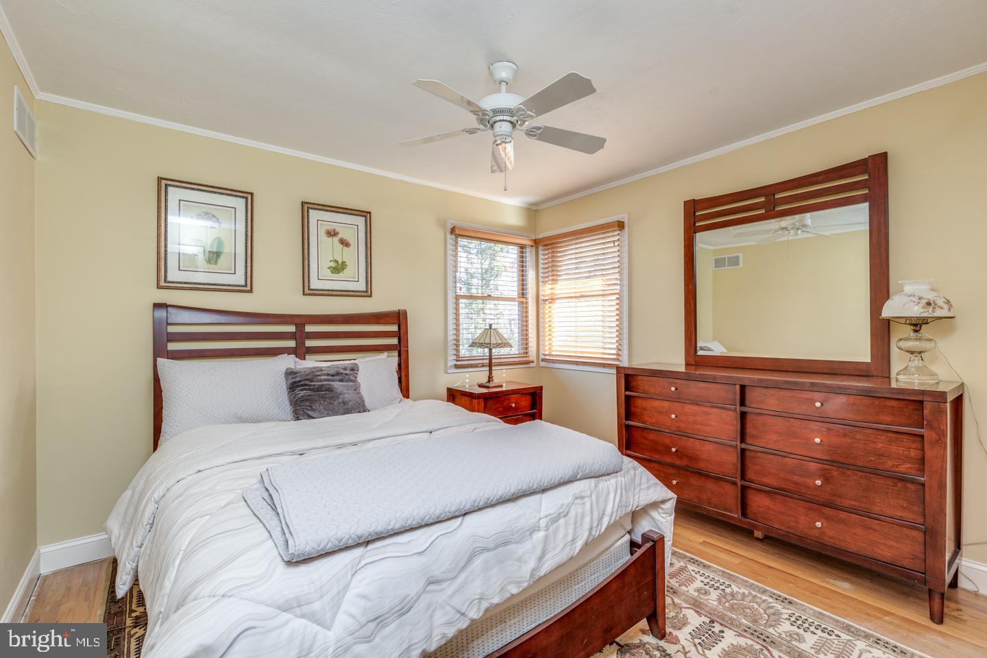 7 Forest Avenue Medford, NJ 08055 - Photo 21 of 43 a bedroom with a large bed and a chandelier
