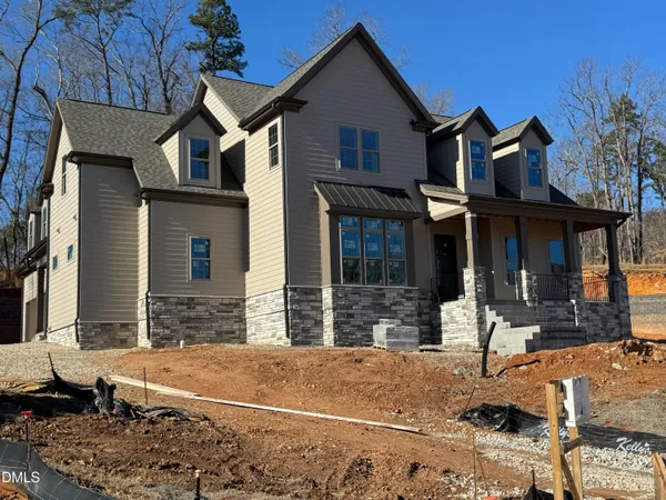 a front view of a house with large windows