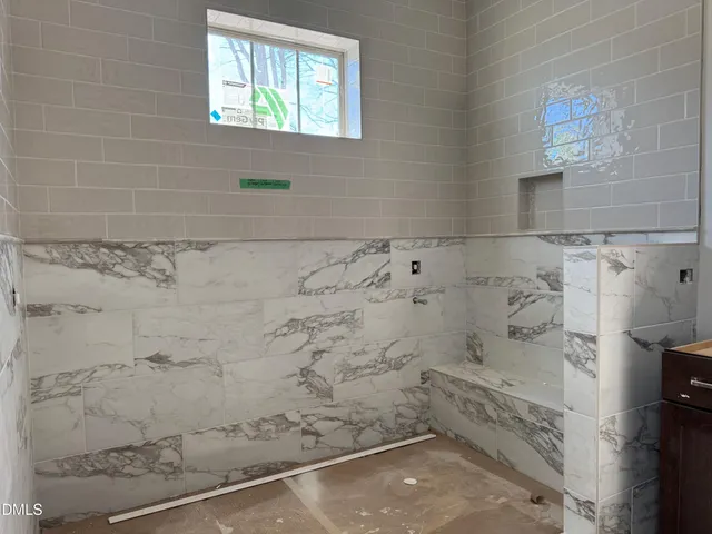 a bathroom with a toilet a sink and a mirror