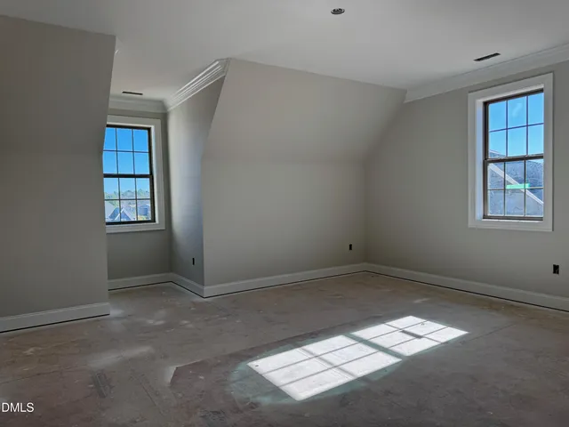 a picture of a bathroom with a white wall