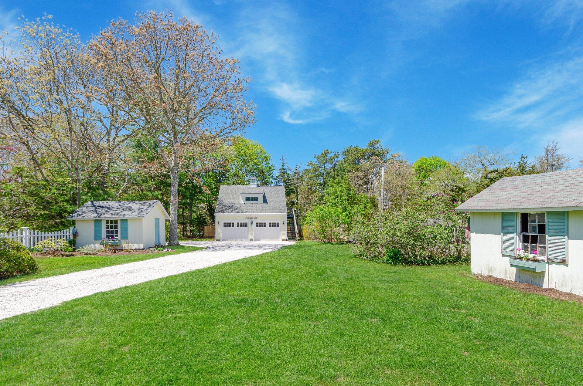 1089 Main Street Cotuit, MA 02635 - Photo 4 of 41 a view of a house with a yard porch and sitting area