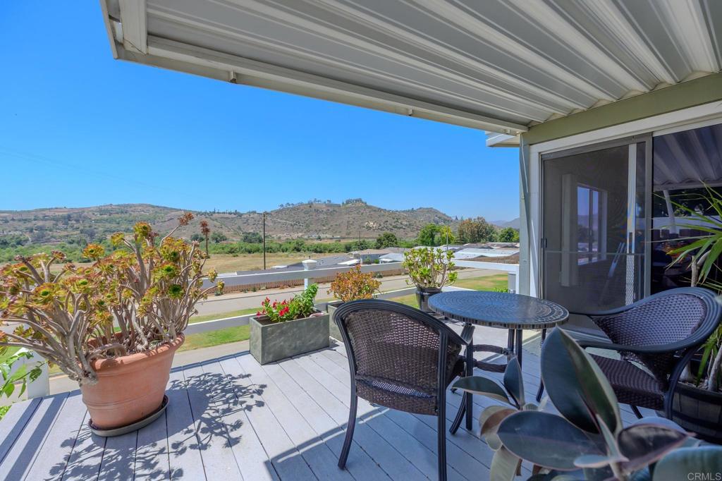 4650 Dulin Road, Unit 27 Fallbrook, CA 92003 - Photo 10 of 37 a view of a balcony with furniture and a potted plant