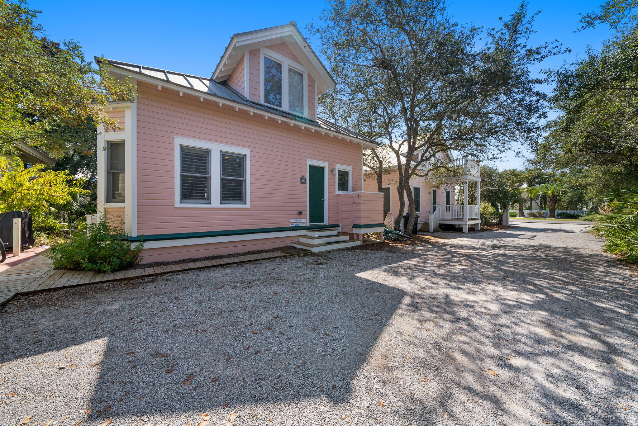 29 Rosewalk Alley Santa Rosa Beach, FL 32459 - Photo 17 of 26 a backyard of a house with yard and garage