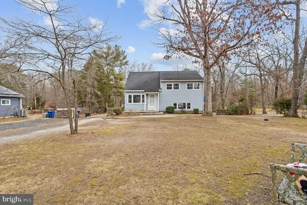 a house with trees in front of it