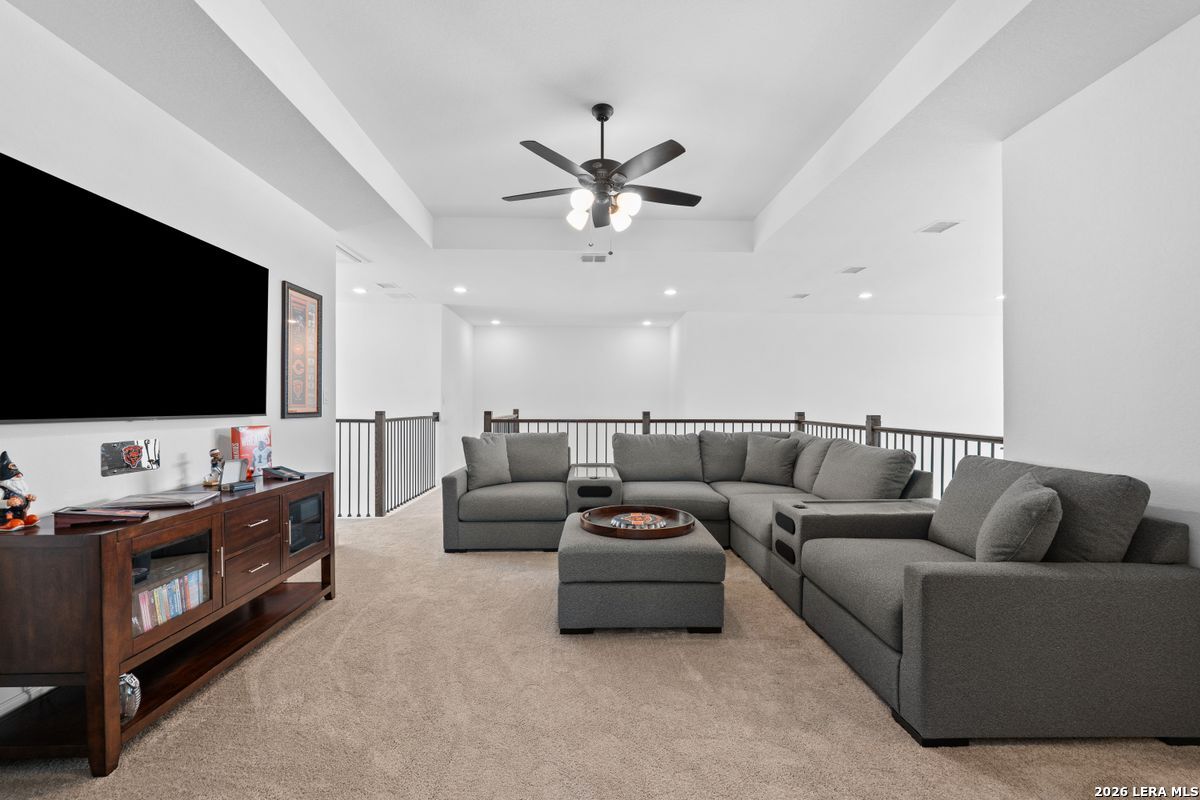 402 Fandango Boerne, TX 78006 - Photo 20 of 34 a living room with furniture and a flat screen tv