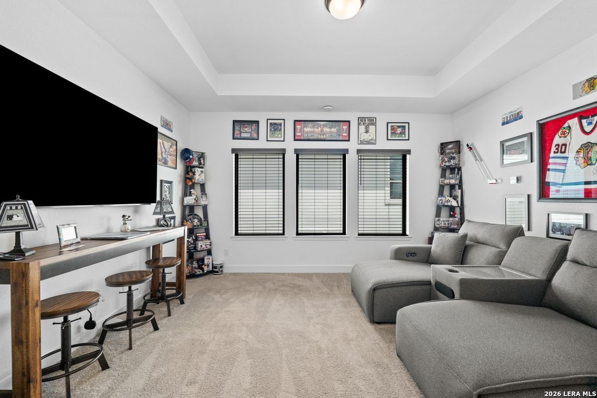 402 Fandango Boerne, TX 78006 - Photo 21 of 34 a living room with furniture and a flat screen tv