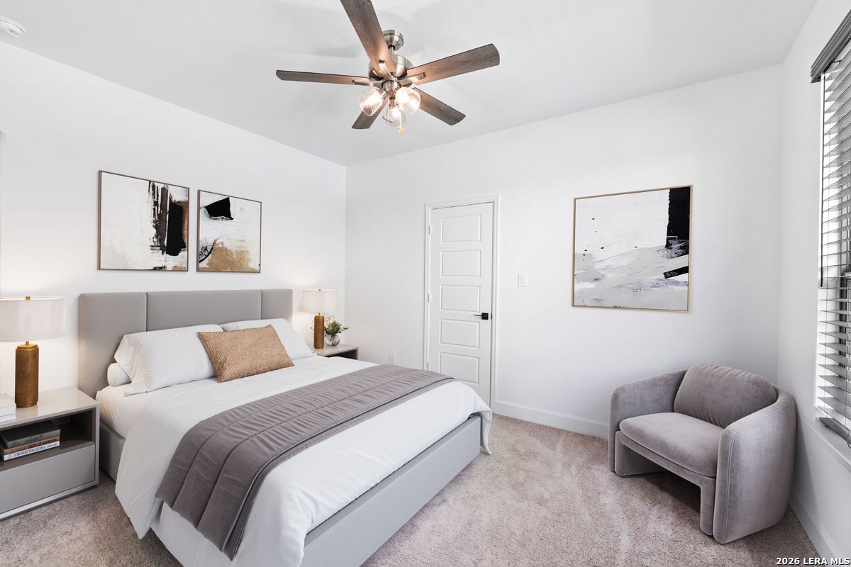 402 Fandango Boerne, TX 78006 - Photo 23 of 34 a bedroom with a bed and a couch