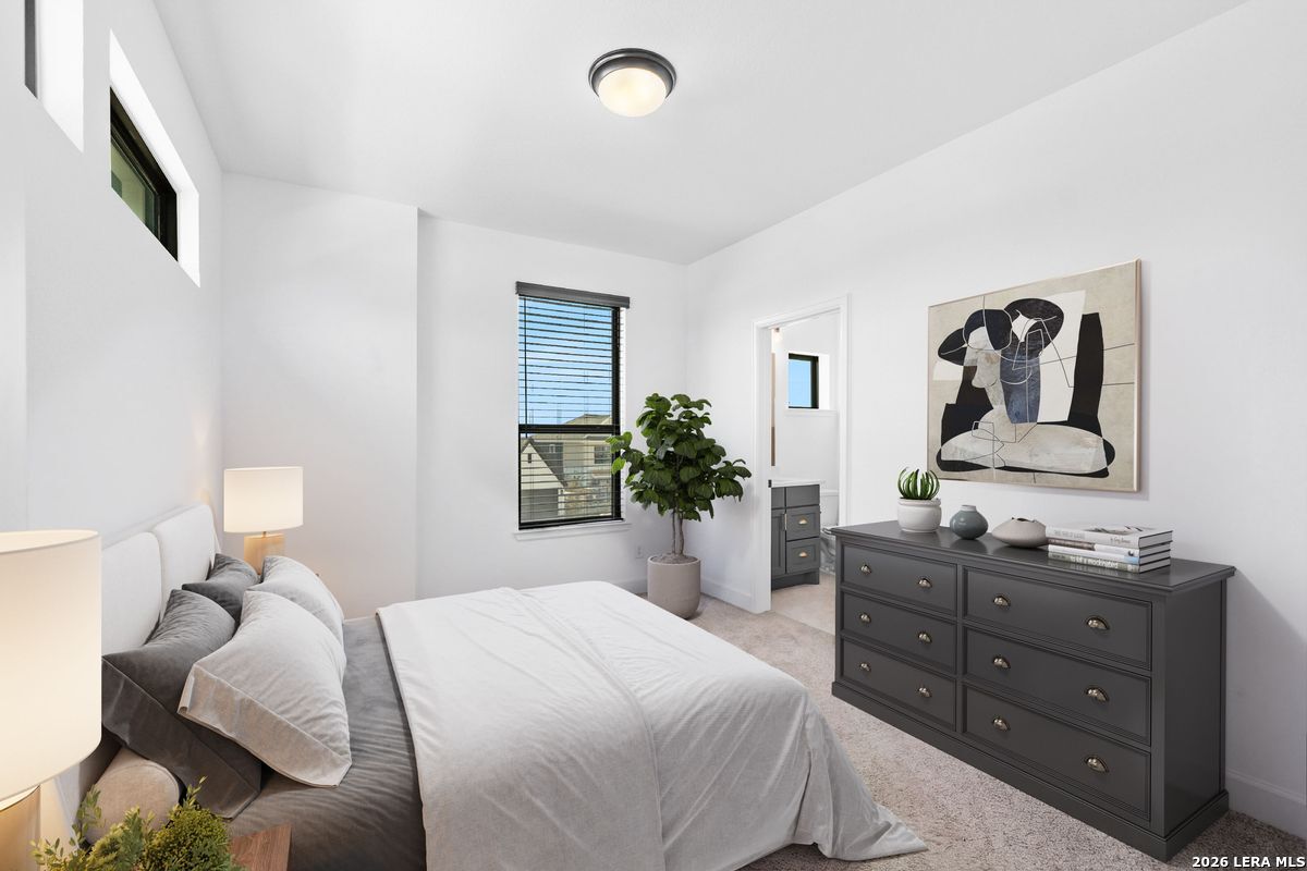 402 Fandango Boerne, TX 78006 - Photo 25 of 34 a bedroom with a bed and a dresser