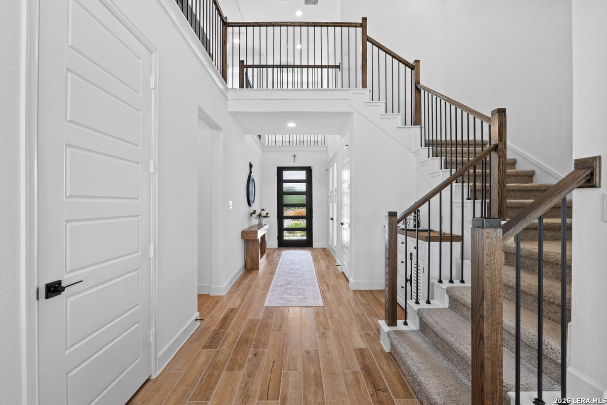 402 Fandango Boerne, TX 78006 - Photo 3 of 34 a view of a hallway with wooden floor and entryway