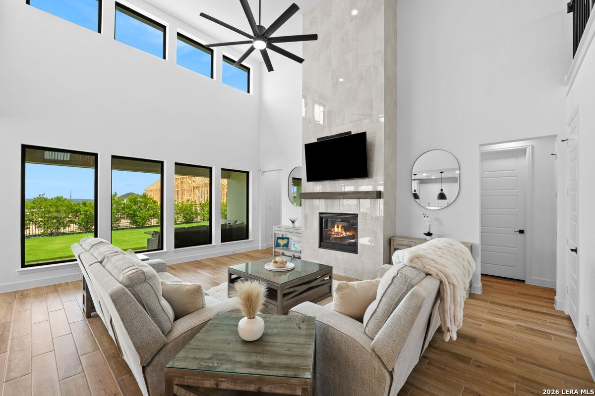 402 Fandango Boerne, TX 78006 - Photo 6 of 34 a living room with furniture fireplace and a large window