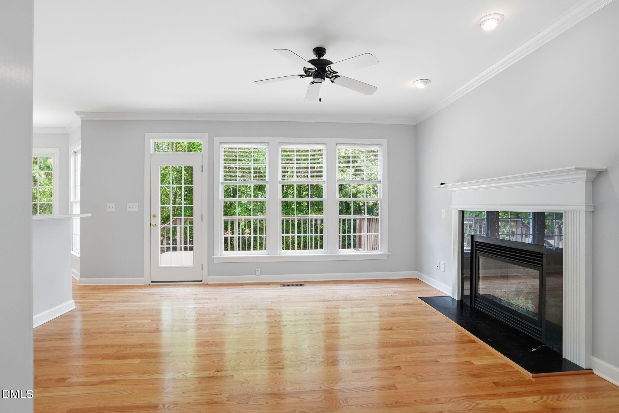 7 Morgans Ridge Lane Durham, NC 27707 - Photo 17 of 75 a view of an empty room with a fireplace and a window
