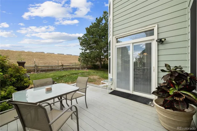 a view of a house with yard and sitting area