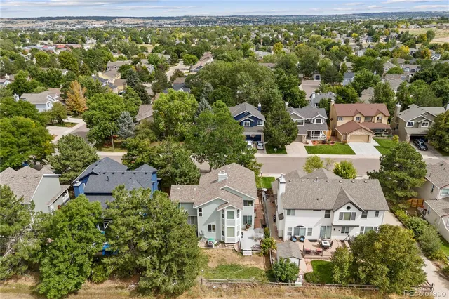 an aerial view of houses with yard
