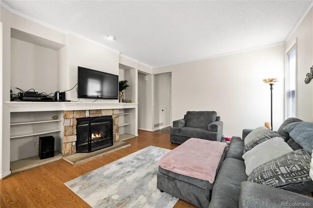 a bedroom with a bed and a fireplace