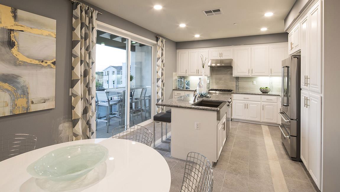 1653 Centre Pointe Drive Milpitas, CA 95035 - Photo 11 of 28 a kitchen with stainless steel appliances granite countertop a sink refrigerator and cabinets