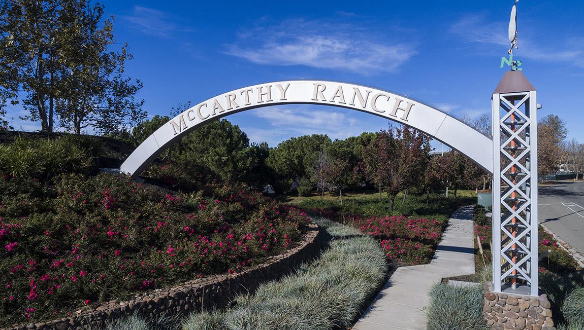 1653 Centre Pointe Drive Milpitas, CA 95035 - Photo 21 of 28 a view of a swimming pool next to a yard