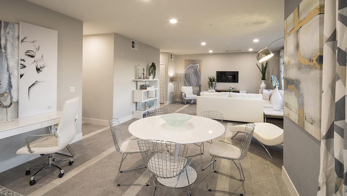 1653 Centre Pointe Drive Milpitas, CA 95035 - Photo 9 of 28 a living room with a dining table chairs and a dining table with wooden floor