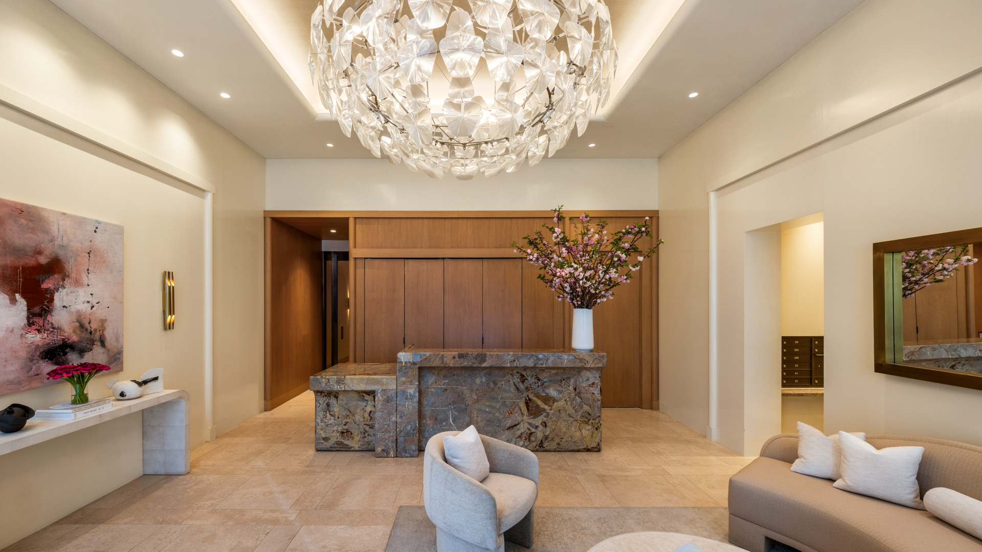 201 East 74th Street, Unit 6A Manhattan, NY 10021 - Photo 12 of 21 a living room with furniture and a chandelier