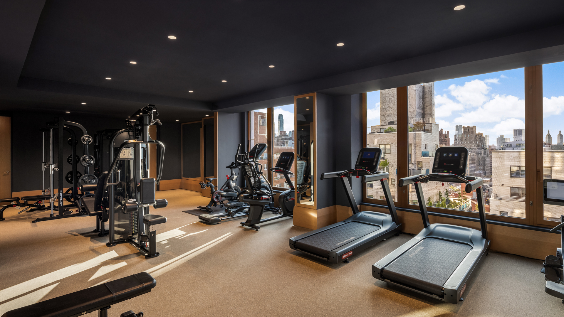 201 East 74th Street, Unit 6A Manhattan, NY 10021 - Photo 14 of 21 a view of a room with gym equipment