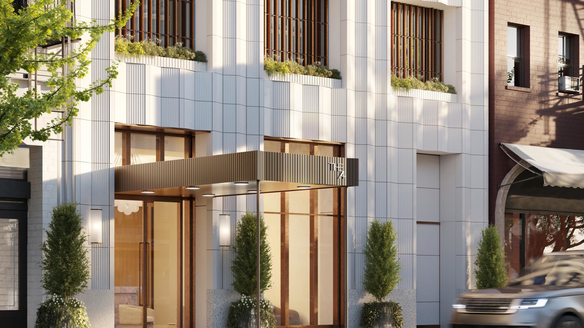 201 East 74th Street, Unit 6A Manhattan, NY 10021 - Photo 7 of 21 a front view of a building with a glass door