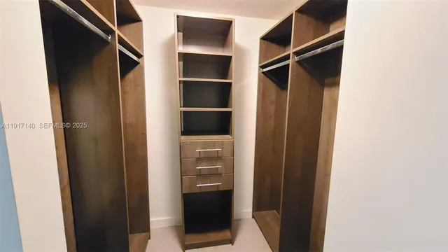 a bathroom with a sink a mirror and a bathtub