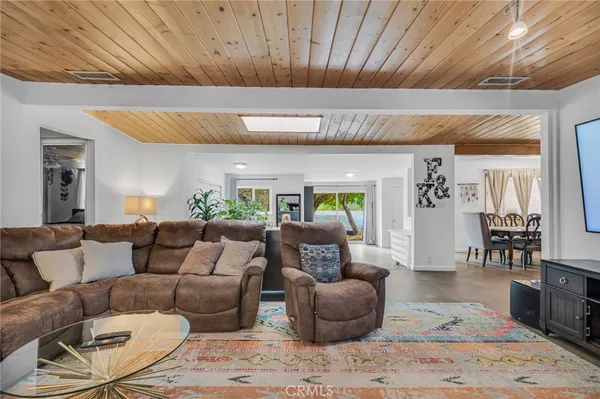a view of a room with gym equipment and large windows