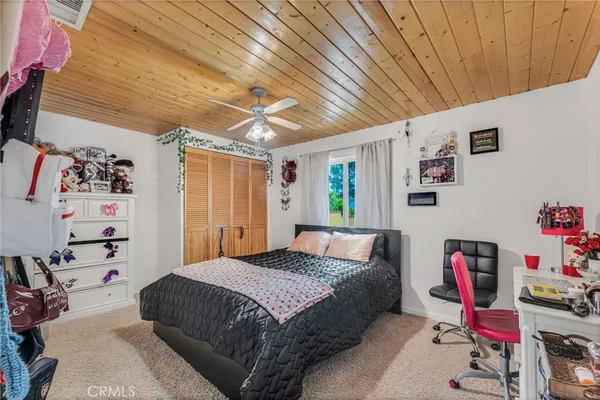 a spacious bedroom with two beds and a couch