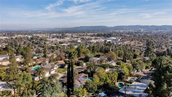 an aerial view of residential house and green space