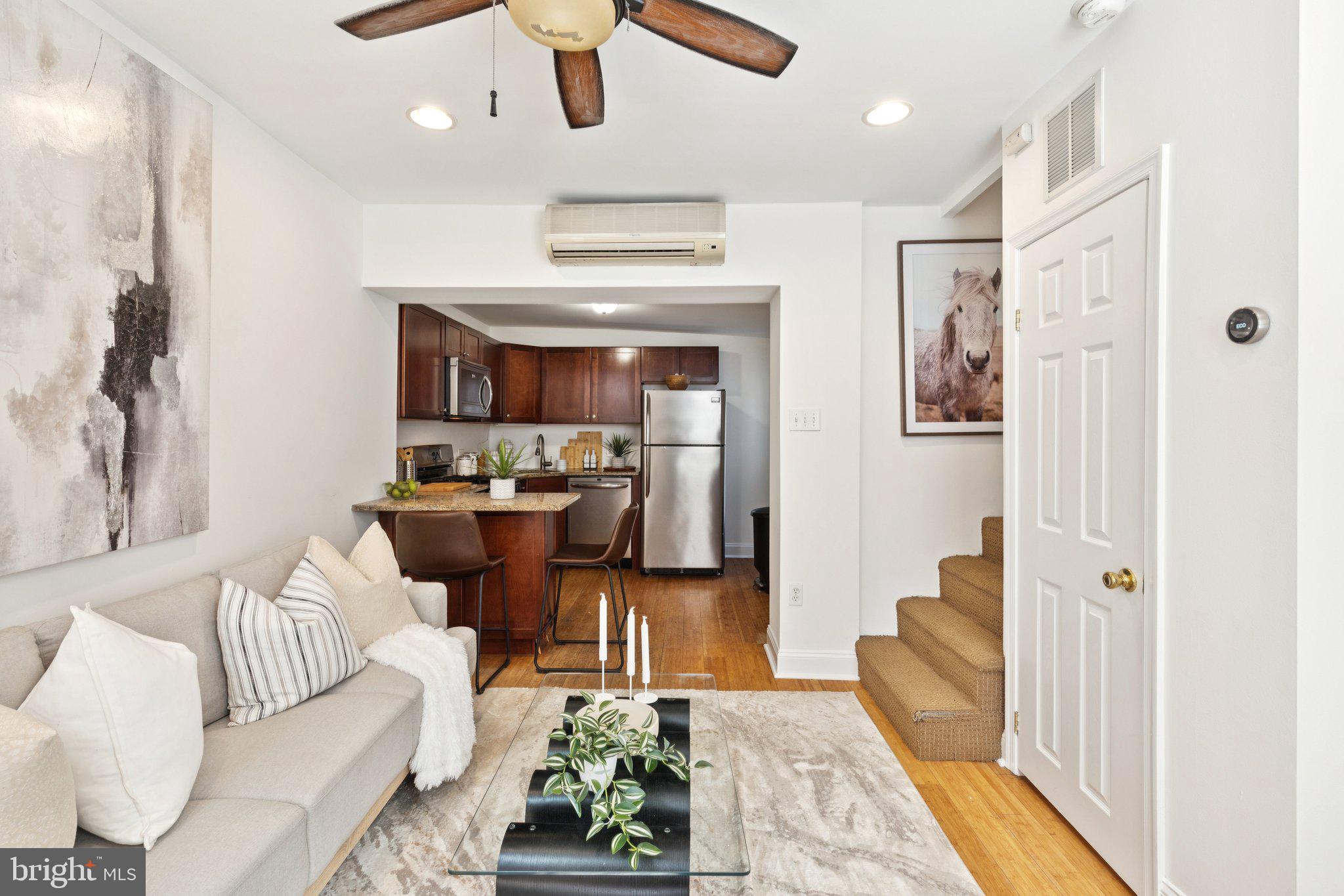 525 Fitzwater Street, Unit 4 Philadelphia, PA 19147 - Photo 1 of 20 a living room with furniture and a rug
