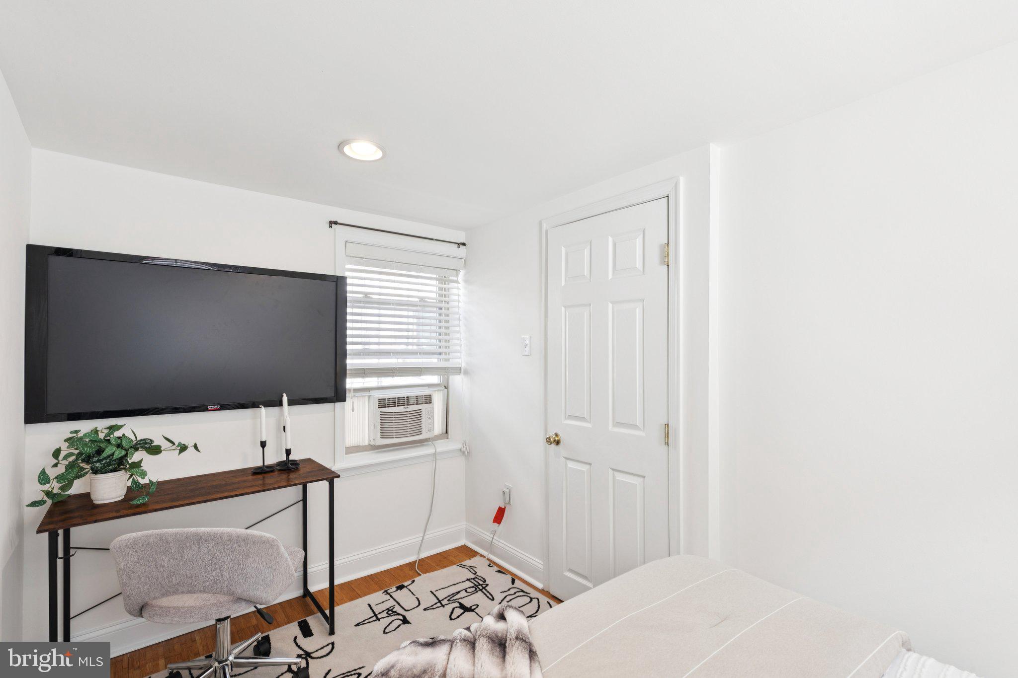 525 Fitzwater Street, Unit 4 Philadelphia, PA 19147 - Photo 12 of 20 a living room with furniture and a flat screen tv