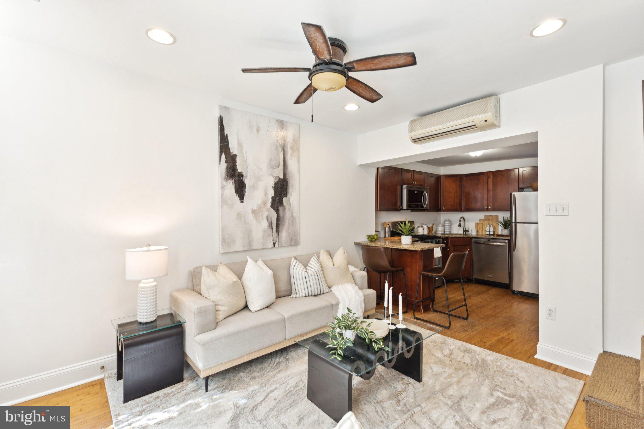 525 Fitzwater Street, Unit 4 Philadelphia, PA 19147 - Photo 2 of 20 a living room with furniture kitchen view and a window