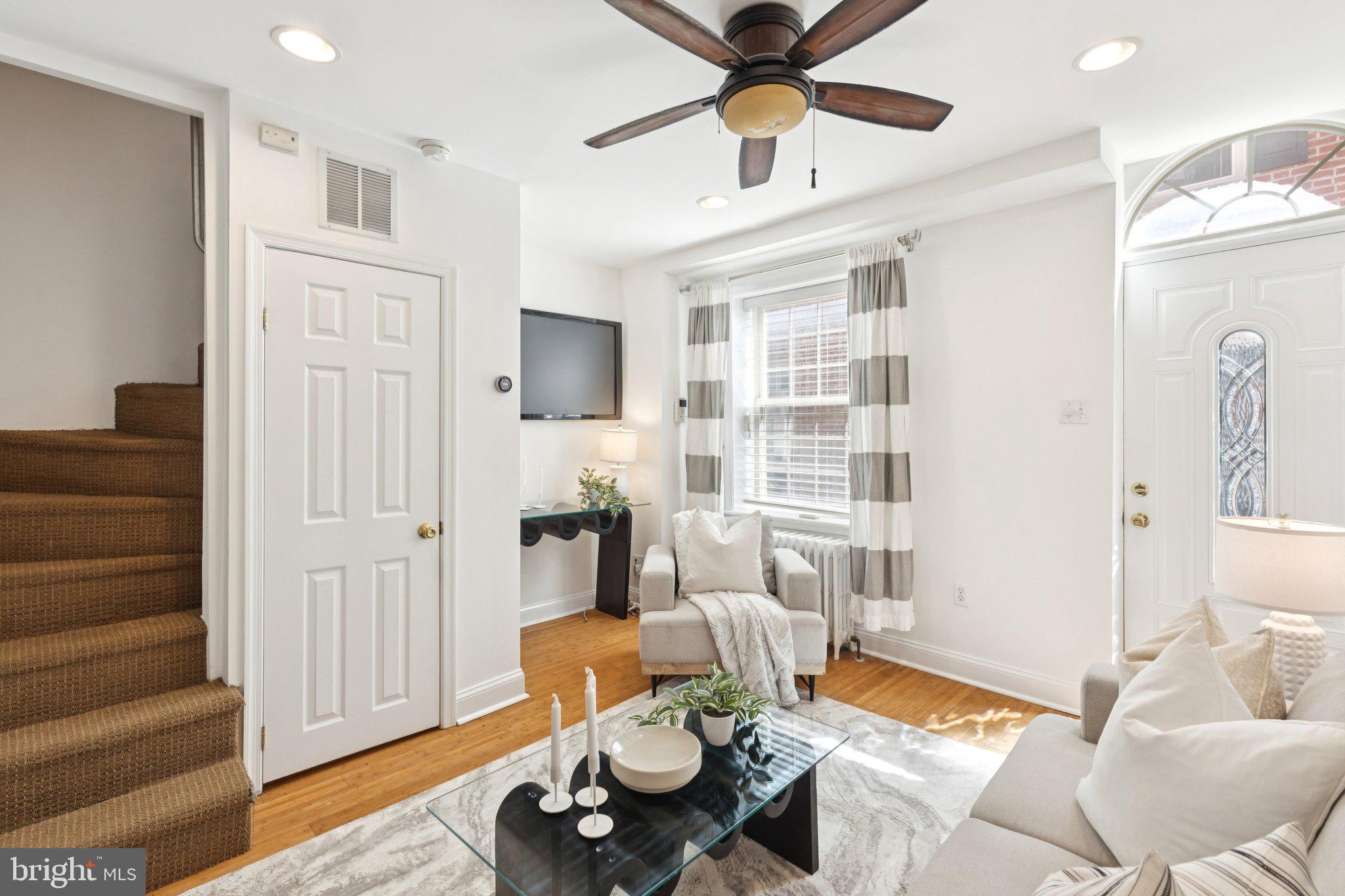 525 Fitzwater Street, Unit 4 Philadelphia, PA 19147 - Photo 4 of 20 a living room with furniture and a flat screen tv