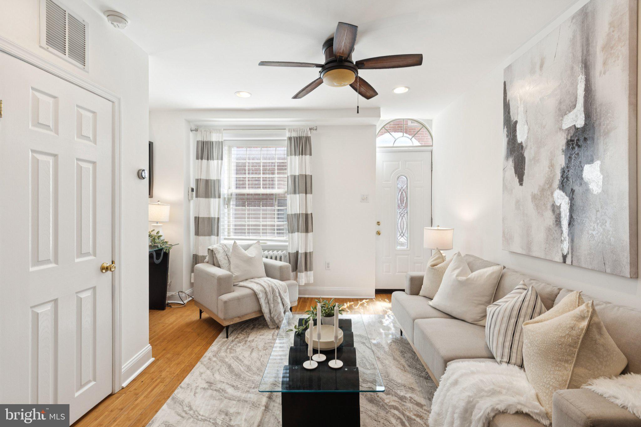 525 Fitzwater Street, Unit 4 Philadelphia, PA 19147 - Photo 5 of 20 a living room with furniture and a window