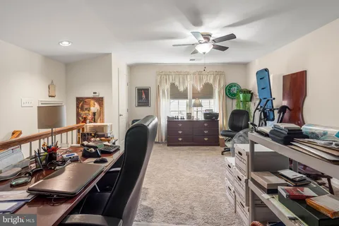 a view of a workspace with furniture and a livingroom
