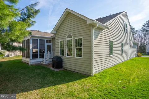a view of backyard with a garden and plants