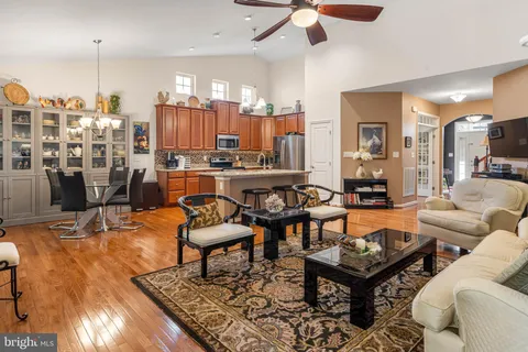 a living room with lots of furniture and a chandelier