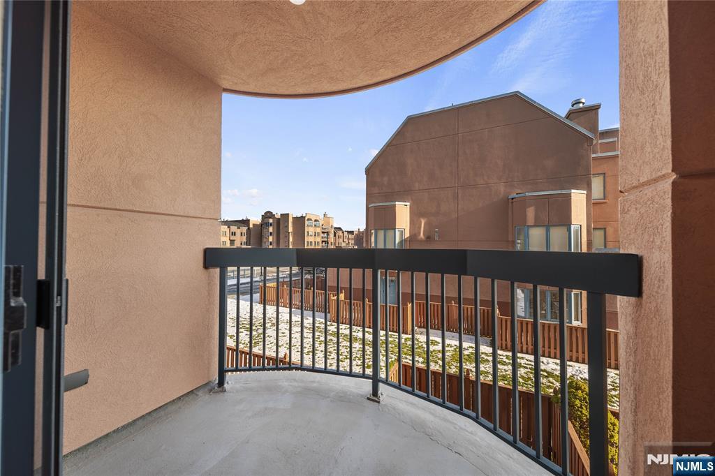 402 Chase Court, Unit 402 Edgewater, NJ 07020 - Photo 17 of 21 a view of a building from a balcony