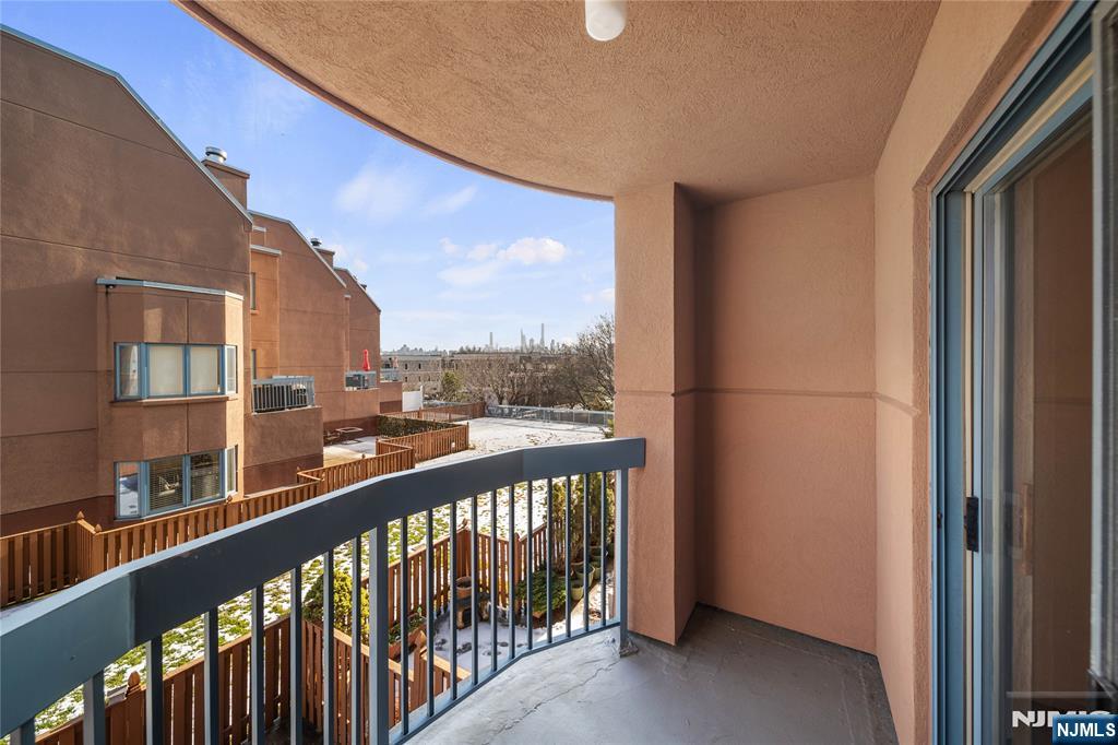 402 Chase Court, Unit 402 Edgewater, NJ 07020 - Photo 18 of 21 a city view from a balcony